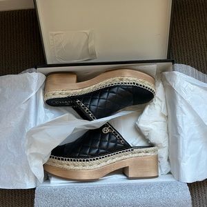 Chanel black clogs with gold hardware